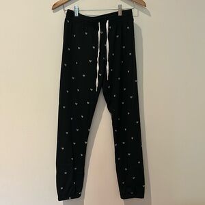 Black pajama pants with gray hearts